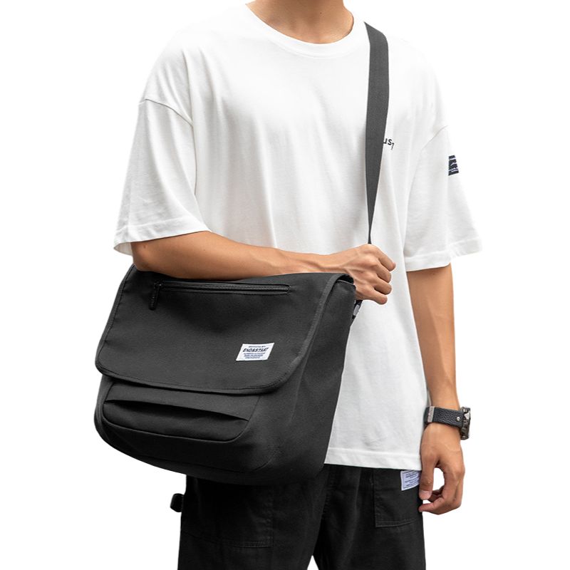 Spacious-Black-Messenger-Bag-wear-by-model